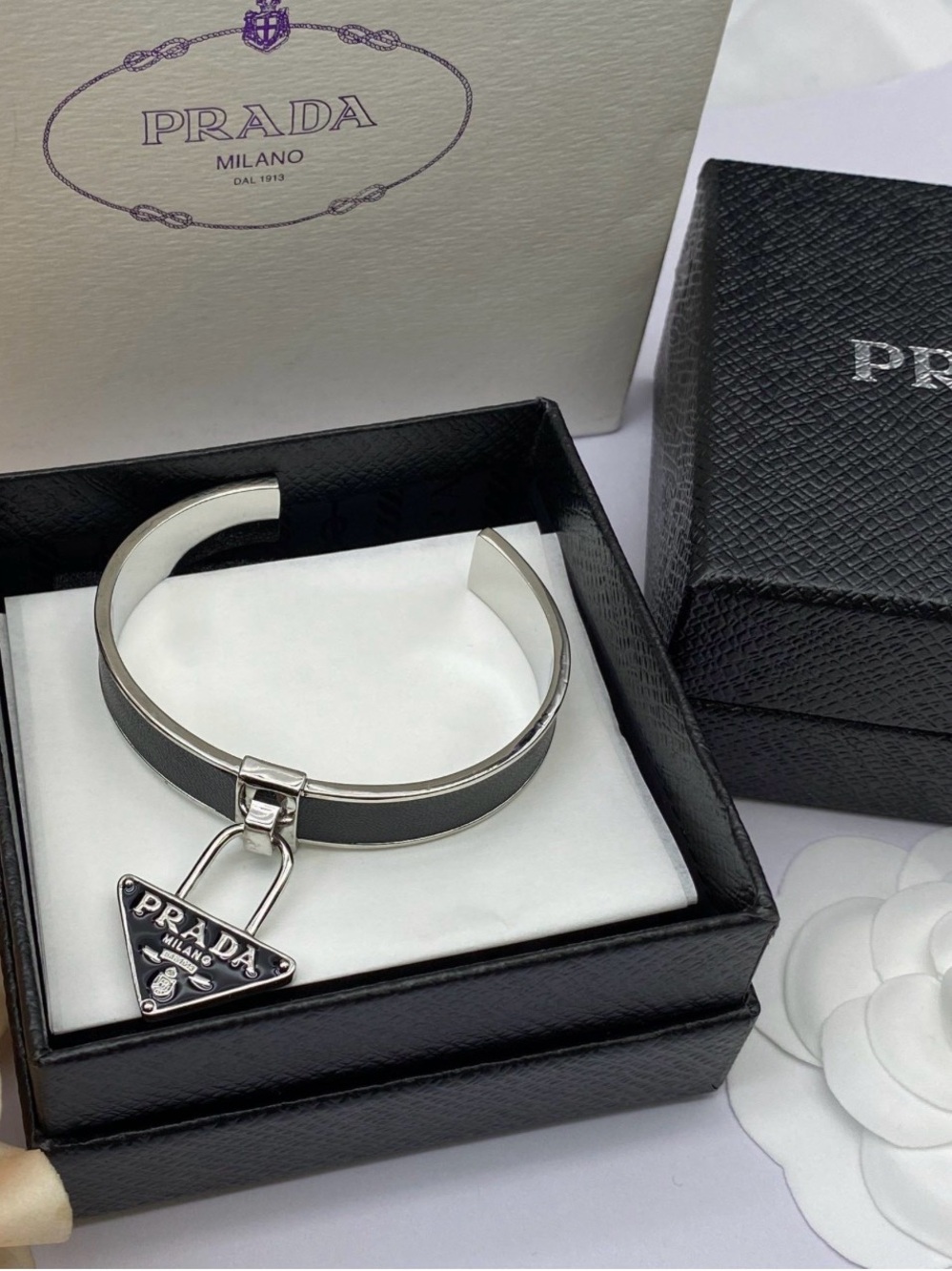 Prada Silver-Tone Cuff Bracelet with Black Leather Inlay and Logo Charm